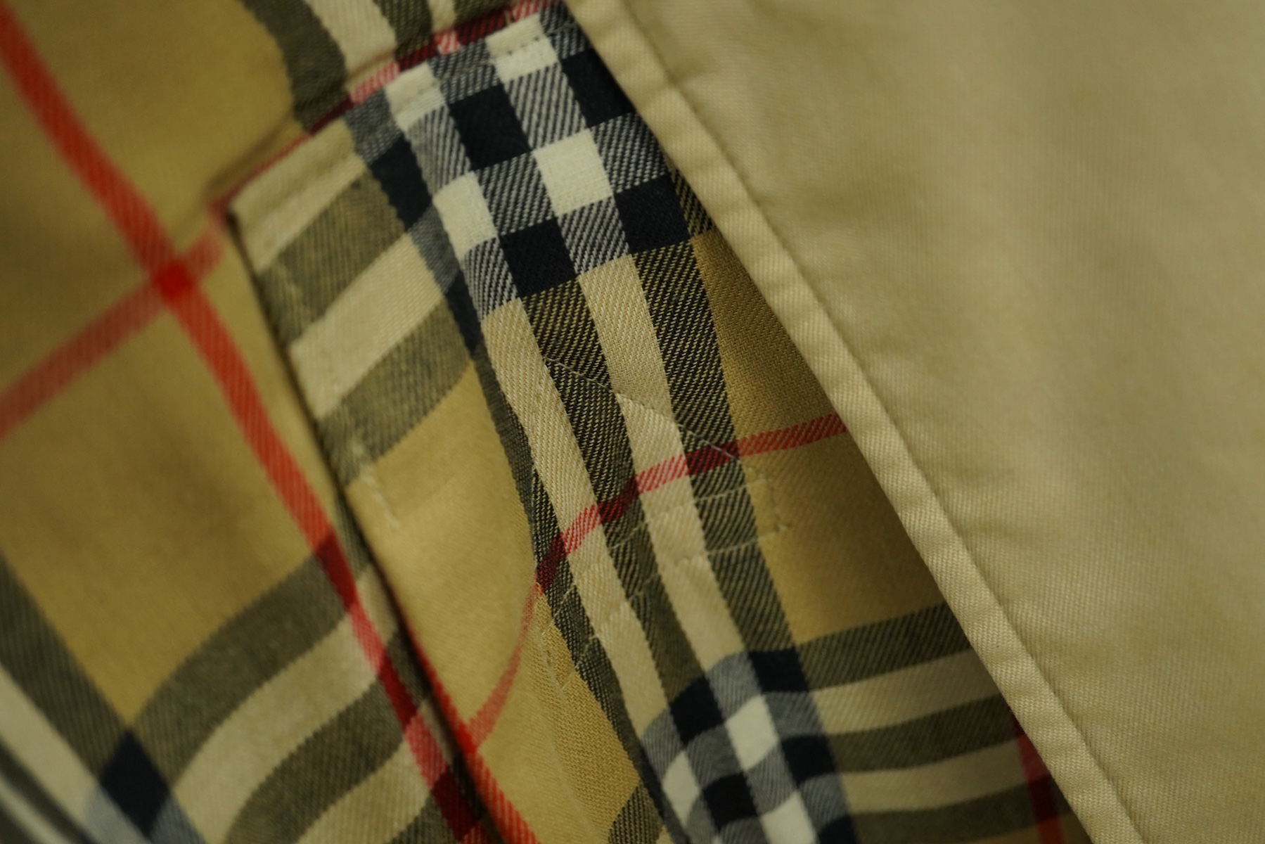 A ladies Burberry mac with check lining and belt, size 16 Long